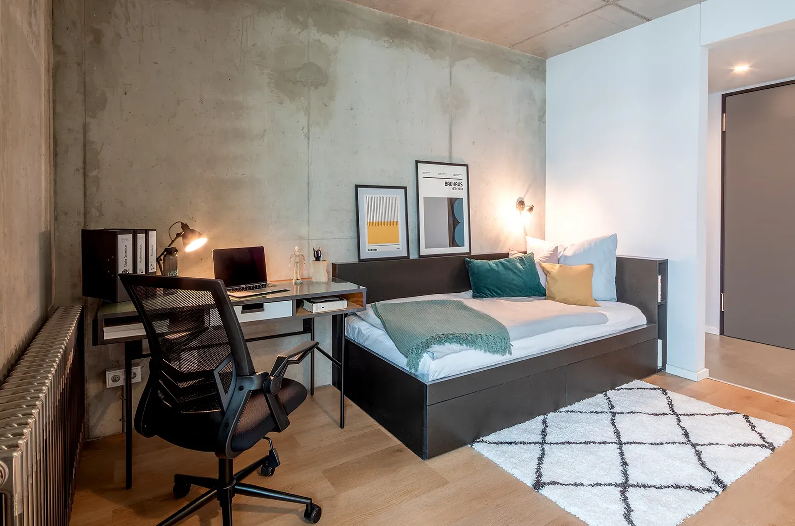 Styled bed area in a Deluxe Balcony Room at Neon Wood Berlin Frankfurter Tor showing decorated sleeping space and personalization example